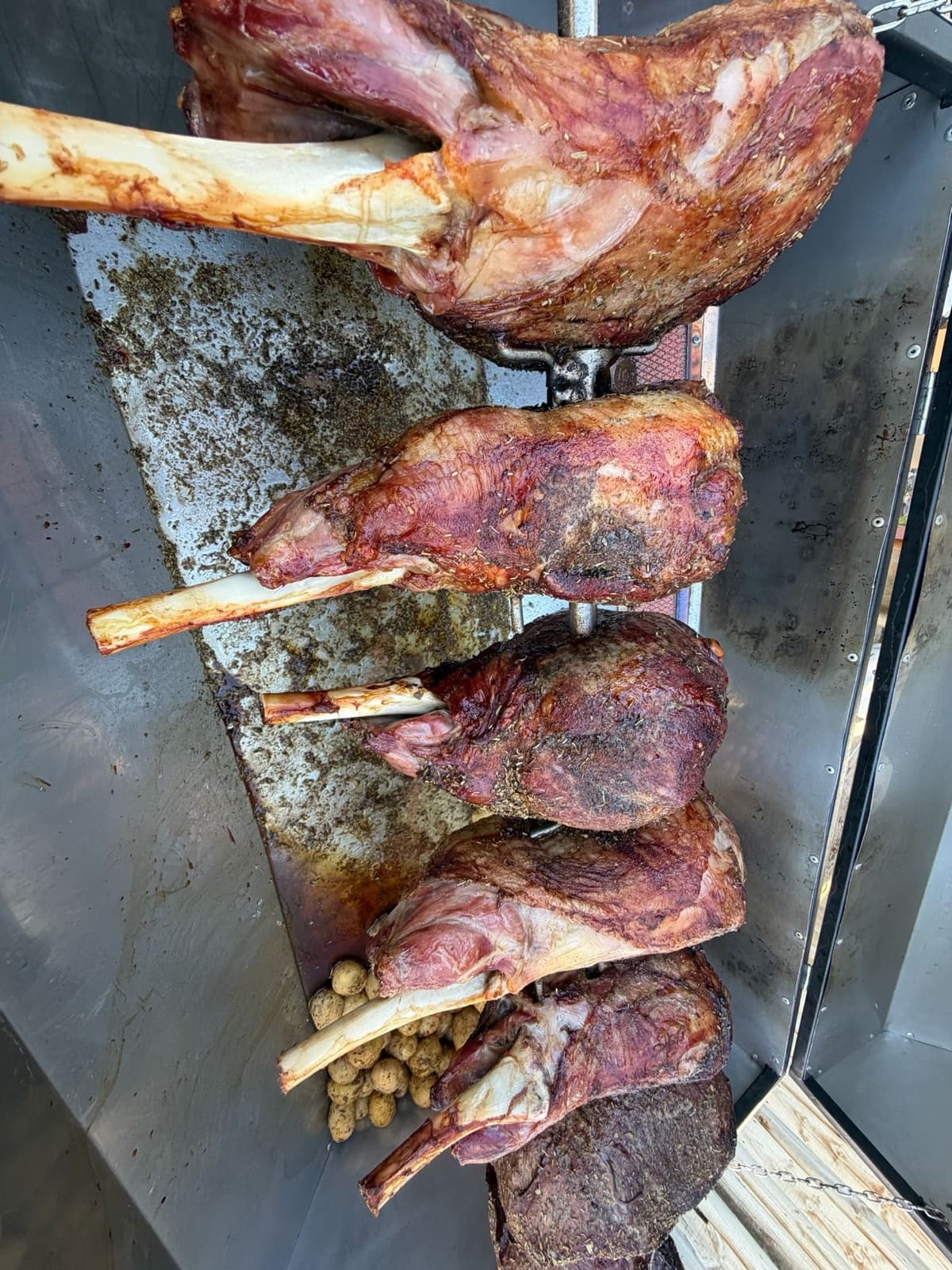 Chef tending the spit on-site