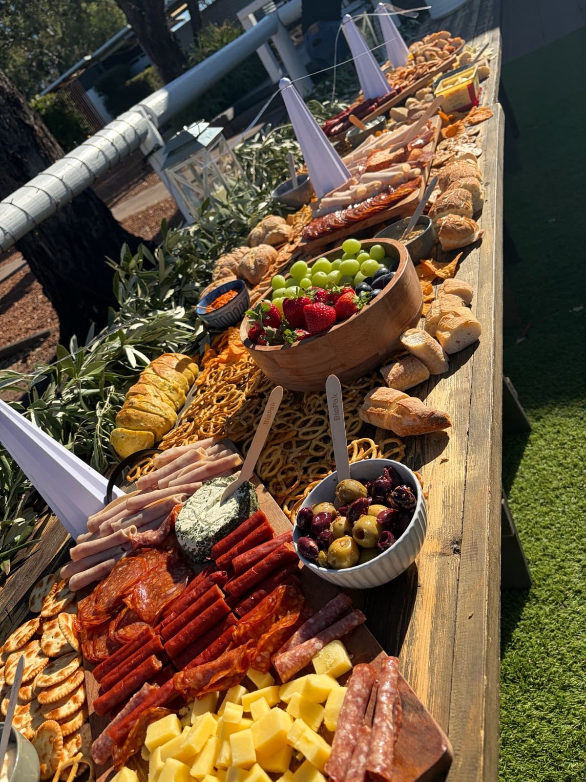 Grazing table with charcuterie, cheese and breads